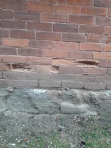 damaged brick wall